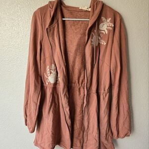 Pink sweater with white embroidered flowers